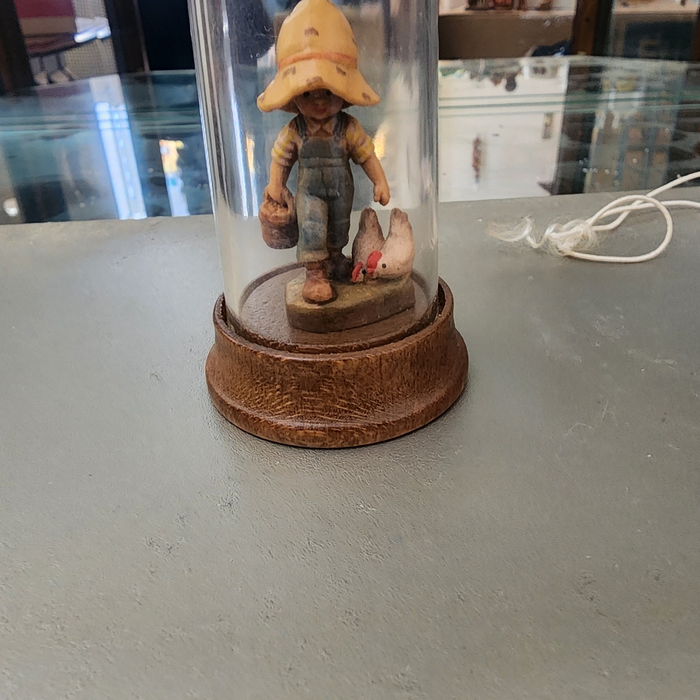 ANRI Figurine Of A Boy Wearing A Hat With A Chicken